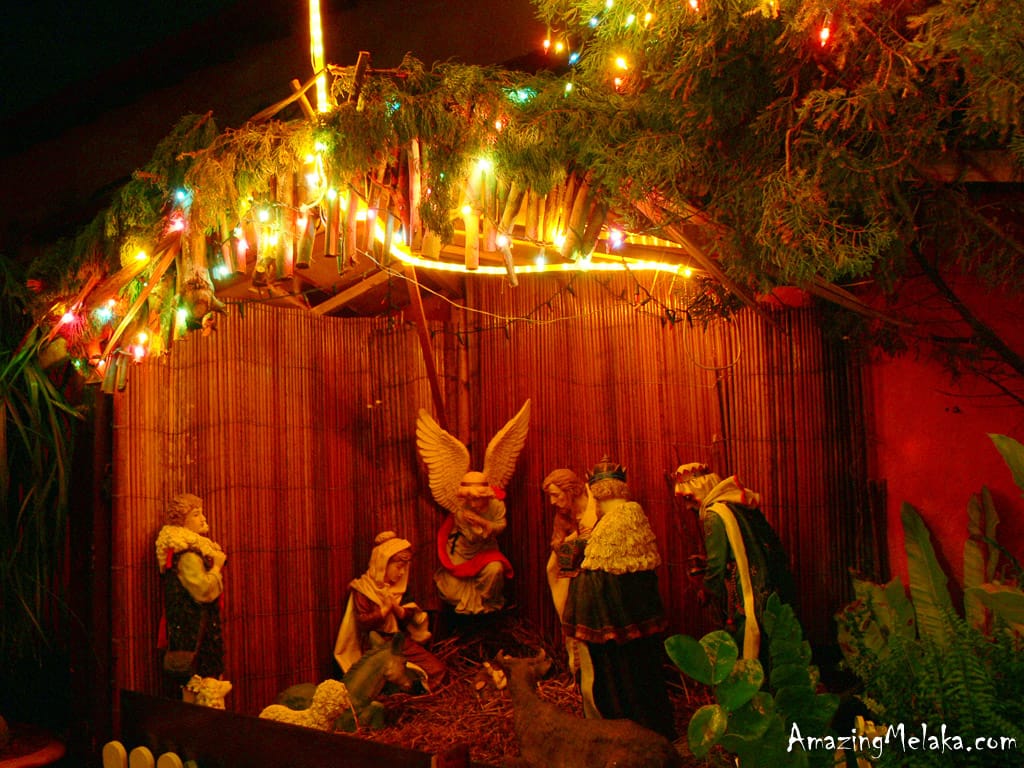 Illuminated nativity scene featuring Mary, Joseph, and the Three Wise Men displayed during the Portuguese settlement Melaka Christmas celebrations.