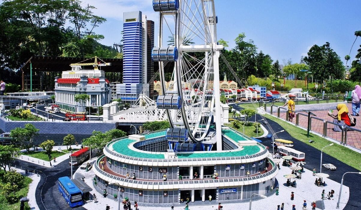 A highly detailed LEGO replica of the Singapore Flyer Ferris wheel and surrounding city landscape in the Miniland section of the Legoland theme park Johor.